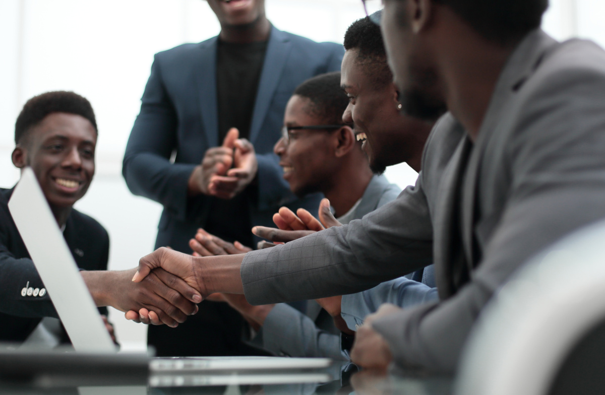 close up. young businessman shaking hands with his business partner